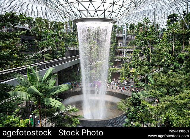 Singapore, Republic of Singapore, Asia - Interior garden of the Shiseido Forest Valley with the Rain Vortex indoor waterfall in the centre of the modern Jewel...