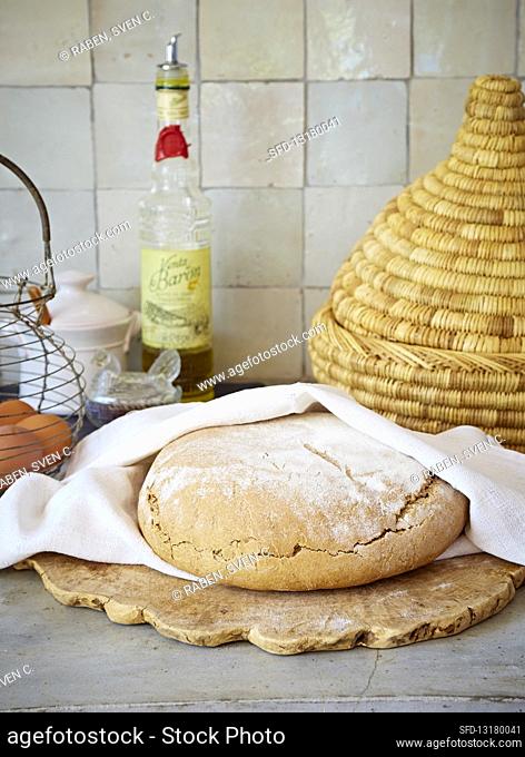 Freshly baked bread in a linen cloth