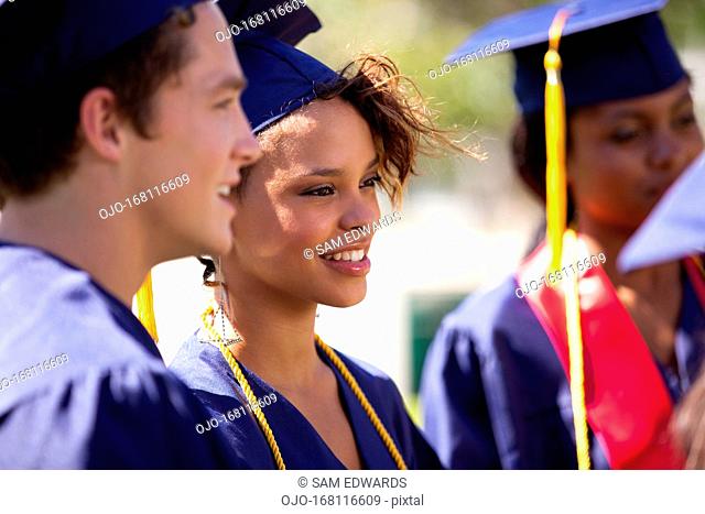 Graduates smiling in cap and gown