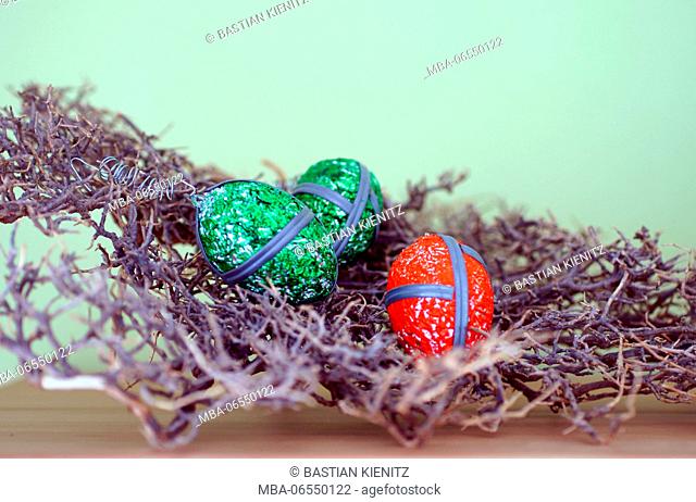 Macro shot of striking Easter eggs in a twig net