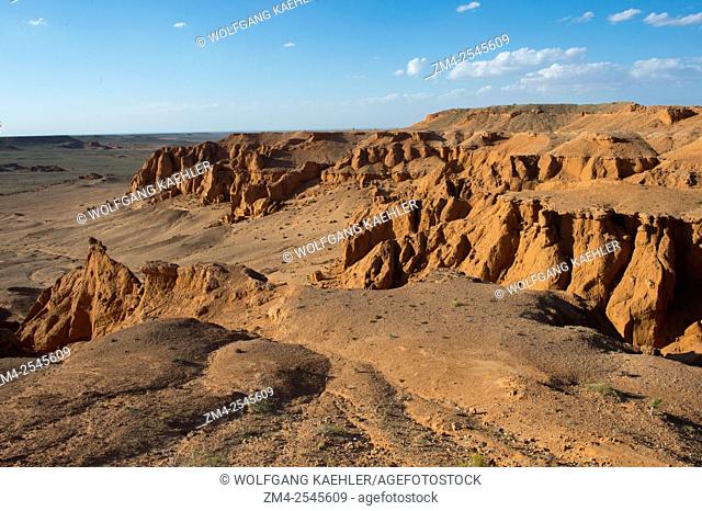 The orange rocks of Bayan Zag, commonly known as the Flaming Cliffs in the Gobi desert, Mongolia where important dinosaur fossils were found