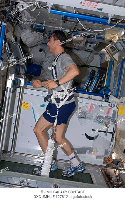 Japan Aerospace Exploration Agency astronaut Satoshi Furukawa, Expedition 28 flight engineer, equipped with a bungee harness