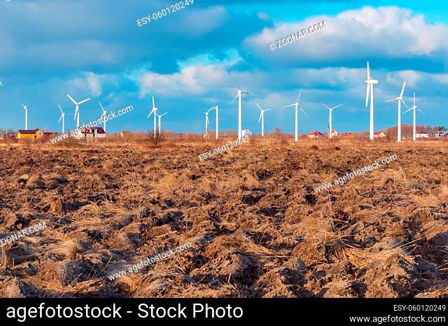 many wind turbines in the field, white wind power plants
