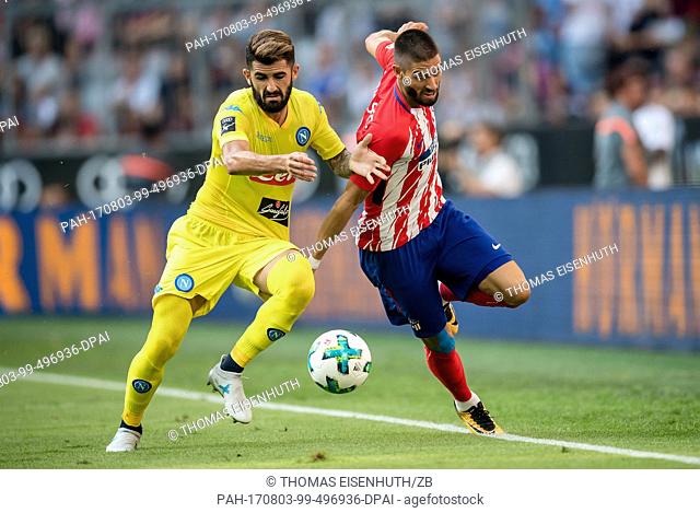 Napoli's Elseid Husaj (L) and Madrid's Yannick Carrasco (R) in action during the game against Atletico Madrid during the AUDI Cup 2017 in the Allianz Arena in...