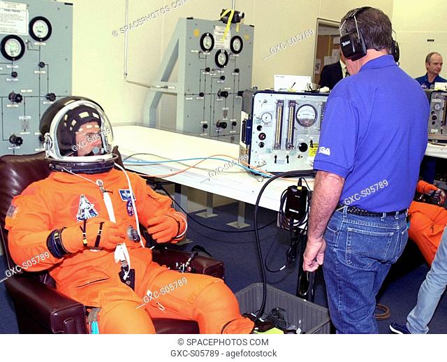 06/05/2002 -- STS-111 Pilot Paul Lockhart gets his helmet checked during suitup for the second launch attempt aboard Space Shuttle Endeavour on mission STS-111...