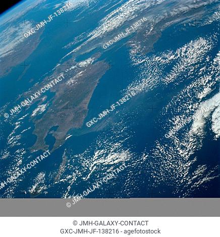 An oblique view of Japan as seen from the Skylab space station in Earth orbit. The Island of Kyushu is at center left. The Island of Honshu is in the right...