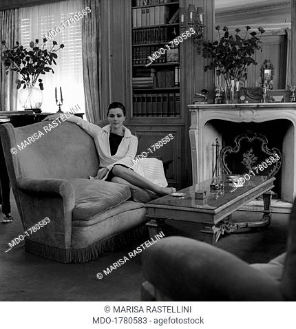 Giovanna Ralli sitting on a sofa. Portrait of Italian actress Giovanna Ralli sitting on the sofa of her house bought with the money earned from her first films