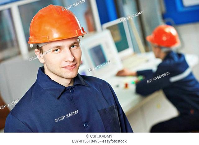 Happy industry worker at factory