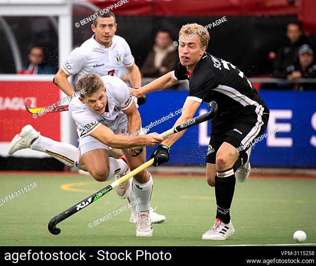 Belgium's Victor Wegnez and German Mario Schachner pictured during a hockey game between the Belgian Red Lions and the German national team