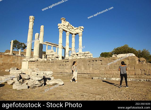Tourists in front of the marble columns and rests of The Sanctuary of Trajan at Bergama Archaeological site of ancient Pergamon city, Bergama Town
