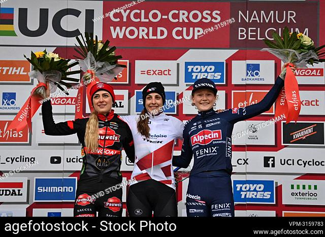 Dutch Denise Betsema, Dutch Lucinda Brand and Dutch Puck Pieterse celebrates on the podium after the women's elite race at the Cyclocross World Cup cyclocross...