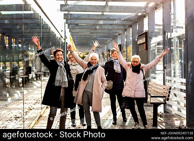 Senior women at train station