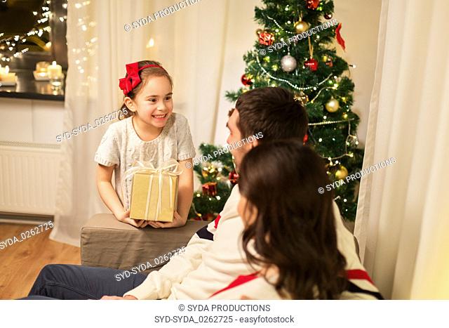 happy family with christmas present at home