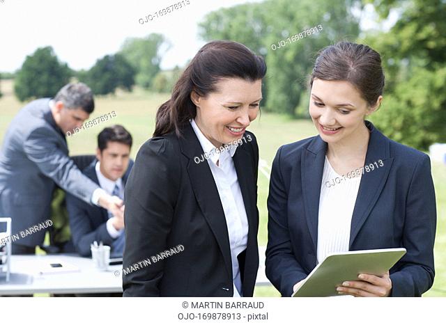 Business people working together outdoors