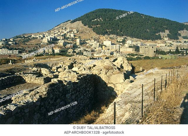Photograph of the ruins of Tel Balata in the modern town of Nablus