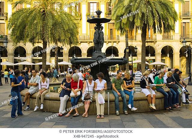 People at the fountain at Placa Reial in central Barcelona Spain Europe