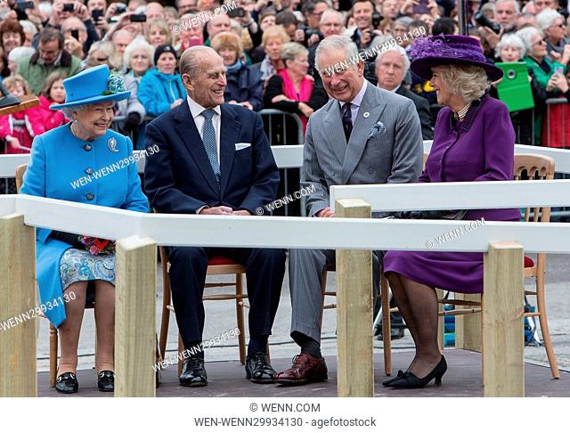 Queen Elizabeth, accompanied by the Duke of Edinburgh and the Duke and Duchess of Cornwall, visits Poundsbury, Dorset, where she unveils a statue of her late...