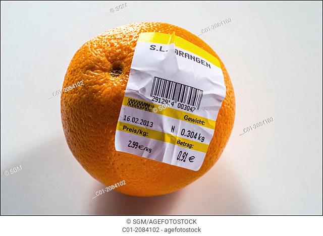 One orange with German bar-coded label showing weight and price in Euro