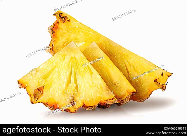 Several slices of pineapple one after another isolated on white background