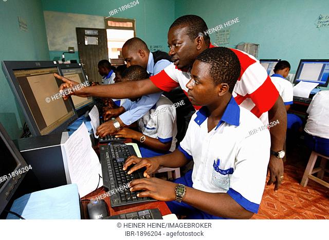 Students in school uniform and teacher during computer lessons, Kumba, Cameroon, Africa