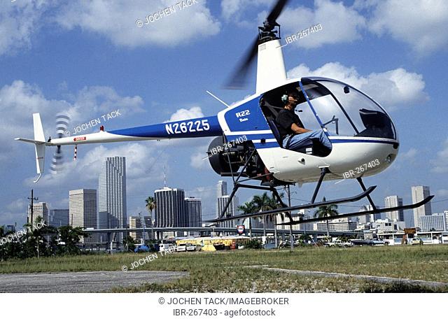 Helicopter in front of the skyline, Miami, Florida, USA