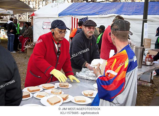Detroit, Michigan - Kitchen volunteers serve lunch at the Occupy Detroit camp in Grand Circus Park