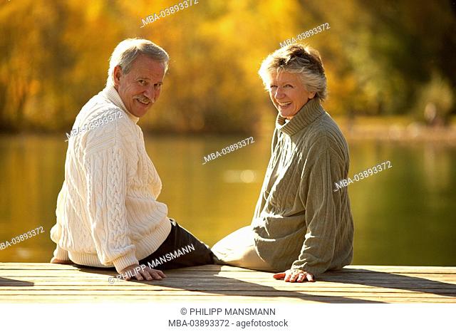 lake, bridge, senior couple, sitting, gaze shoulder, cheerfully, smiling, autumn, dusk, pension people 66 years 60-70 years seniors, two, pair, couple, age