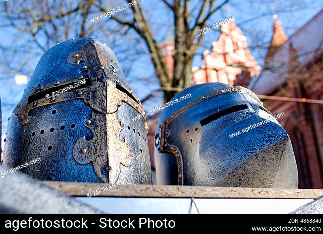 metal medieval ancient knights warrior helmets imitations sold in outdoor street market fair