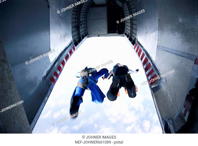 Two parachute jumpers leaving a plane, Sweden