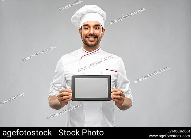 happy smiling male chef showing tablet pc computer