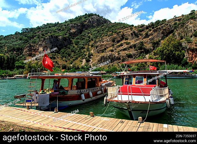 DALYAN, TURKEY - MAY 31, 2015 : Boats for touristic boat trips in the river between Koycegiz Lake and Iztuzu Beach in Dalyan