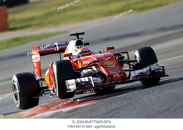 Finnish Formula One driver Kimi Raikkonnen of Ferrari steers his car during the training session for the upcoming Formula One season at the Circuit de Barcelona...