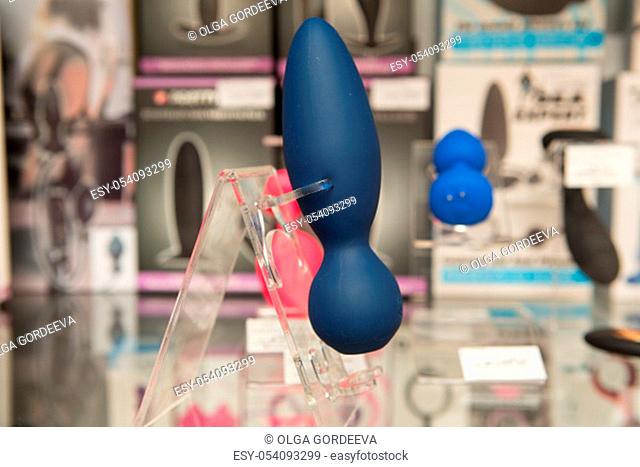 sex toys on a glass display in the store
