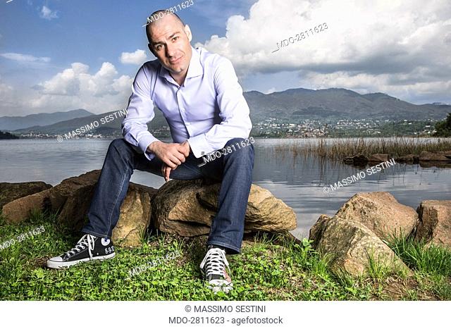 Riccardo Bossi, son of Italian politician Umberto Bossi, posing at Lake Varese during a photo shooting. Italy, Cazzago Brabbia. 13th February 2013