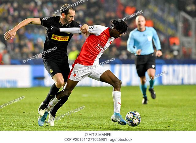 DIEGO GODIN of Inter and PETER OLAYINKA of Slavia in action during the Football Champions League 5th round Group F match Slavia vs Inter Milan in Prague