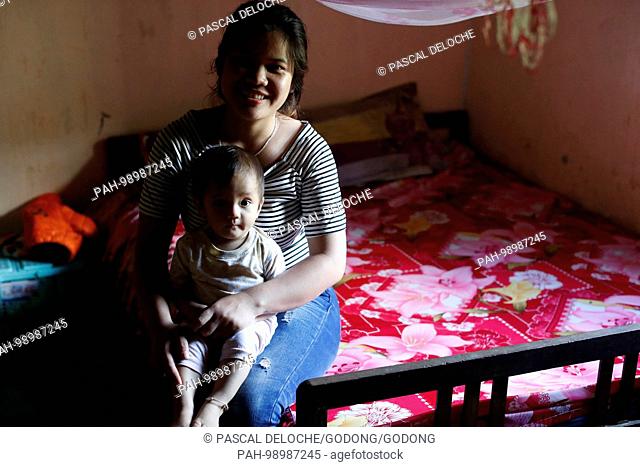 Mother and son at home. Kon Tum. Vietnam. | usage worldwide. - Kon Tum/Kon Tum/Vietnam