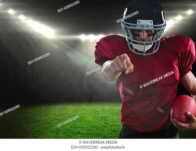 american football player pointing in stadium