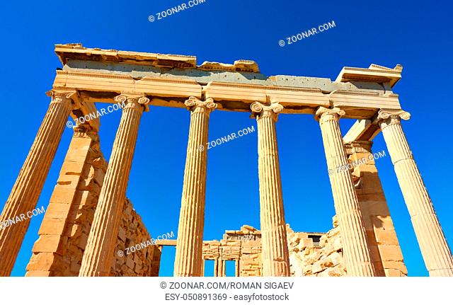 Angle shot of ancient columns of The Erechtheion temple in Acropolis, Athens, Greece