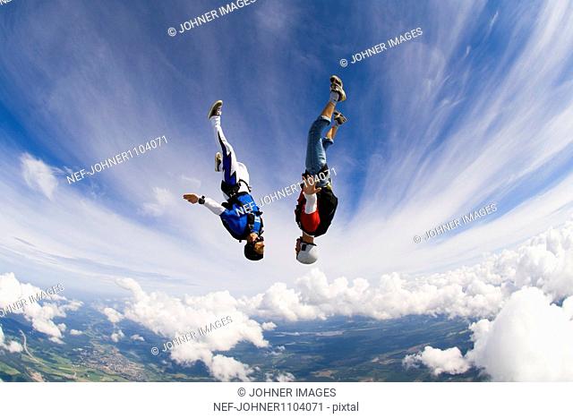 Young couple upside-down in air