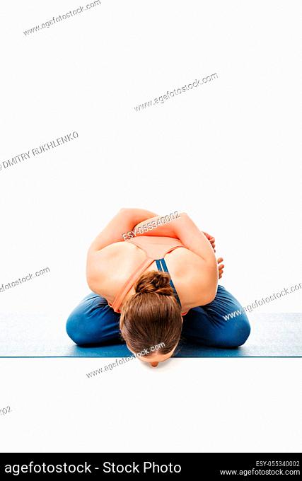 Woman doing Asthanga Vinyasa Yoga asana Yoga mudrasana (yoga mudra) - psychic union pose isolated on white background