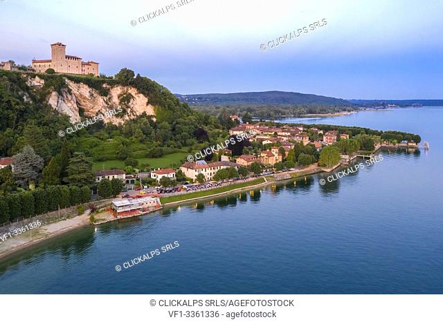 View of the fortress called Rocca di Angera during a spring sunset. Angera, Lake Maggiore, Varese district, Lombardy, Italy