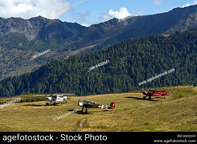 Three aircraft on the Croix-de-Coeur mountain landing field Verbier, from left to right. Piper PA-18-150 Super Cub HB-PMN, Slepcev Storch Mk IV HB-YKQ