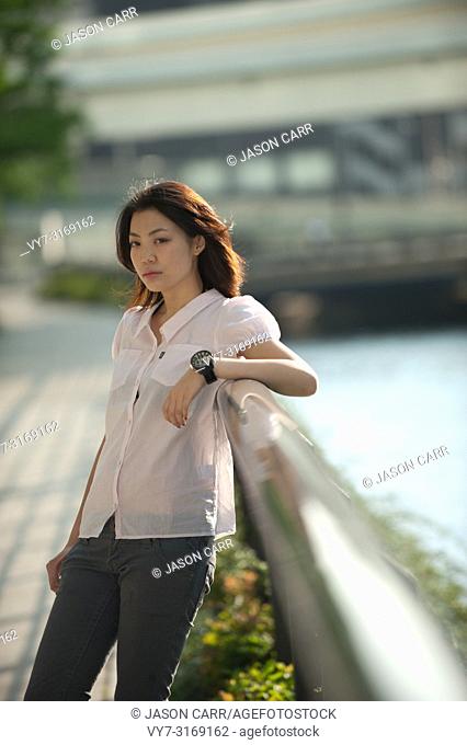Japanese Girl poses on the street in Yokohama, Japan