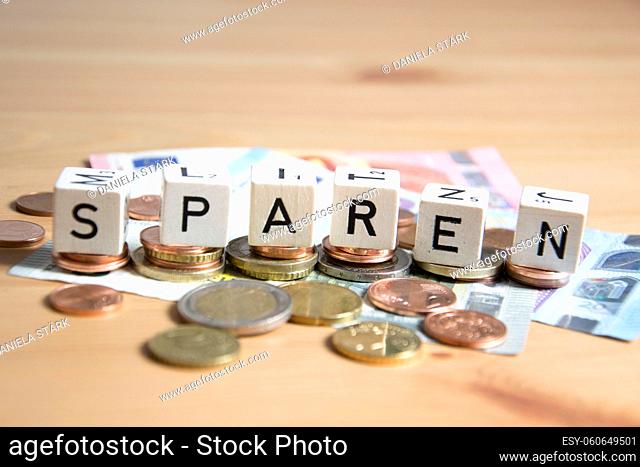 sparen ( german for save) word written on wood cube