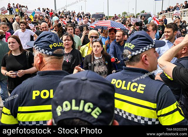 GEORGIA, TBILISI - MAY 19, 2023: Police officers respond to a demonstration at Shota Rustaveli Tbilisi International Airport where an Azimuth flight from Moscow...
