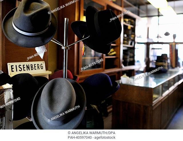Different hats sit on a hat rack in the shop of cap maker Kuentzel in Hamburg, Germany, 15 March 2013. Since 1892 the cap shop Eisenberg produces and sells caps...