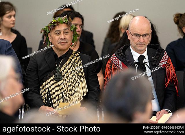 01 June 2023, Lower Saxony, Göttingen: Craig Hawke (r), ambassador of New Zealand, and Chas Karauria Taurima sit during the handover of bones from the...