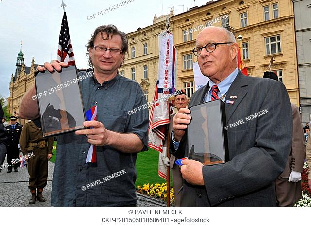 US General George Patton's grandson George Patton Waters, right, and Czech sculptor Lubomir Cermak pose with miniatures of memorial to General George Patton who...