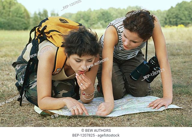 Two women with map