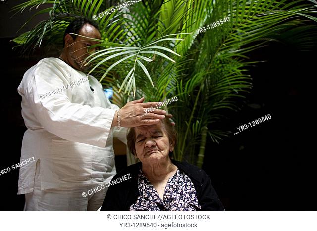 A woman receives Reiki at an elderly home for women in Mexico City, September 30, 2010  Reiki is a spiritual practice developed in 1922 by Japanese Buddhist...